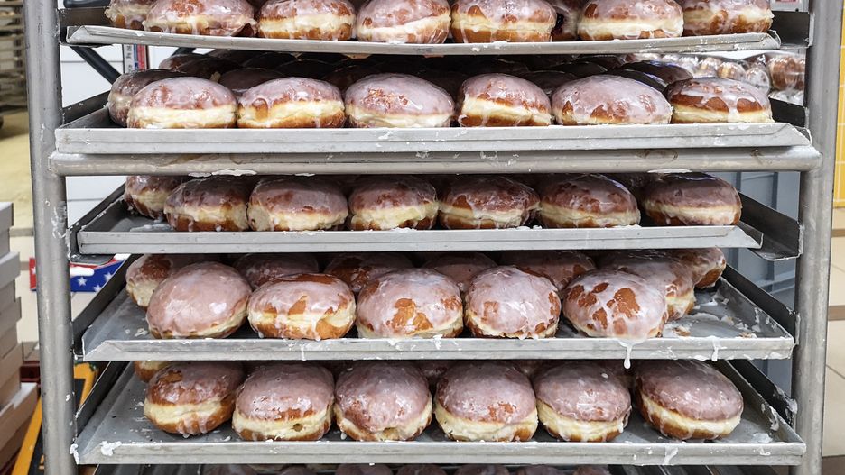 Paczki - traditional fist-sized donut filled with rose marmalade are seen on 20 February 2020 in Gdansk, Poland . Fat Thursday (Pol. Tlusty Czwartek) is a traditional Christian feast on the last Thursday before Lent symbolizing the end of Carrival. Poles will eat over 100 million od 'paczki' this day. (Photo by Michal Fludra/NurPhoto via Getty Images)