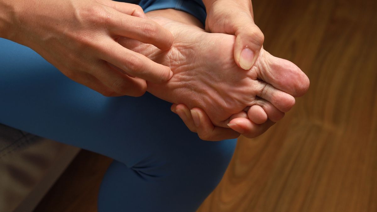 Low Section Of Woman Scratching Foot, Athlete foot.
Asian woman scratch the itch by hand with athlete foot problem in the room
Pikusisi-Studio