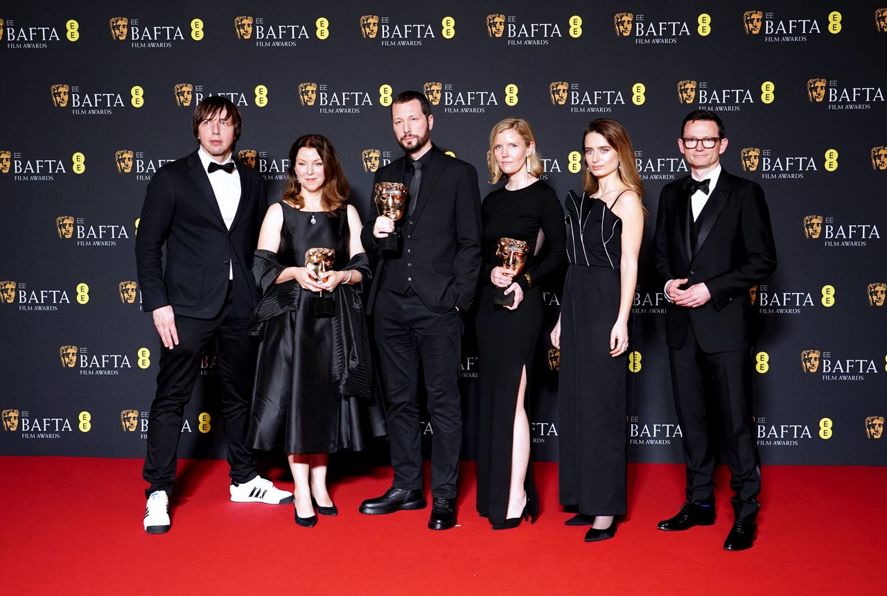 Raney Aronson Rath, Mstyslav Chernov, Michelle Mizner and their team in the press room after winning the Documentary award for 20 Days in Mariupol during the Bafta Film Awards 2024, at the Royal Festival Hall, Southbank Centre, London. Picture date: Sunday February 18, 2024. (Photo by Ian West/PA Images via Getty Images)