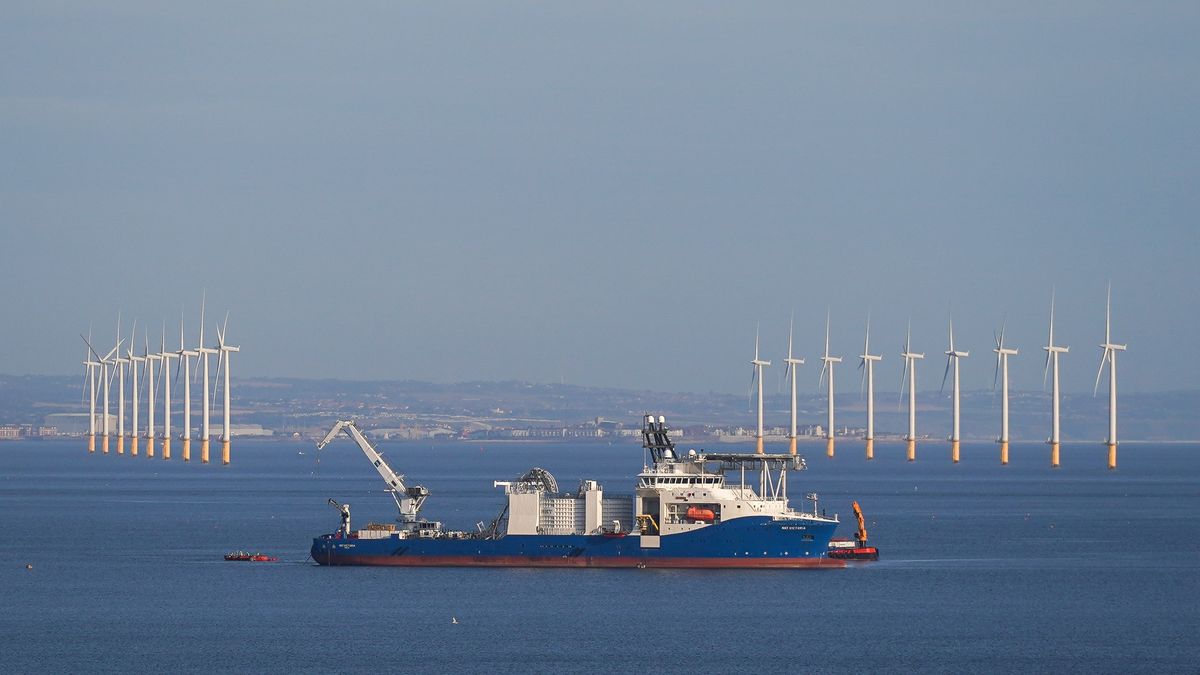 MARSKE-BY-THE-SEA, UNITED KINGDOM - AUGUST 17: The NKT Victoria cable laying ship operates off the coast of Marske by the Sea as it lays cable as part of the Sofia Offshore Wind Farm project on August 17, 2024 in Marske By The Sea, United Kingdom. The 1.4 gigawatt Sofia Offshore Wind Farm is sited on the shallow central area of the North Sea known as Dogger Bank. Currently under construction, the project is located 195 km from the nearest point on the UK’s North East coast on a site of 593 square kilometres. The electricity generated will be transported from there, via a high voltage direct current export cable, to landfall 220 kilometres away near Redcar, Teesside. Power generated by the project will enter the national grid and will supply power to approximately 1.2 million UK households at a rate of 5.4 terawatt-hours a year, contributing nearly half of the annual electricity requirements of the north-east UK. (Photo by Ian Forsyth/Getty Images)