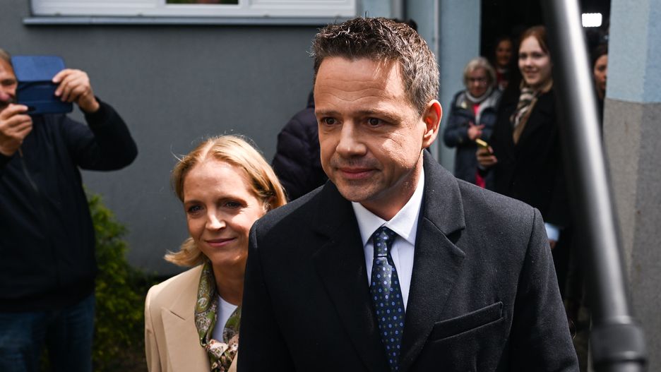 WARSAW, POLAND - MAY 18: The Mayor of Warsaw and the Civic Coalition (KO) presidential candidate, Rafal Trzaskowski and his wife, Malgorzata exit after casting their ballot during the first round of the presidential elections on May 18, 2025 in Warsaw, Poland on May 18, 2025 in Warsaw, Poland. The election is seen as a test of whether the government, with its centrist parliamentary coalition, can overcome the right-wing populism embodied by the Law and Justice Party, which has held the presidency since 2015. (Photo by Omar Marques/Getty Images)