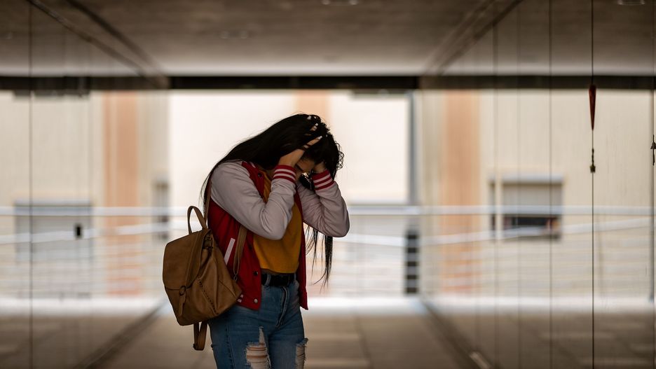 Nervous female student touching head being bullied at school
Side view of teen girl in casual clothing with backpack standing in corridor while worried about bullying at school feeling lonely
Juan Algar
touch head