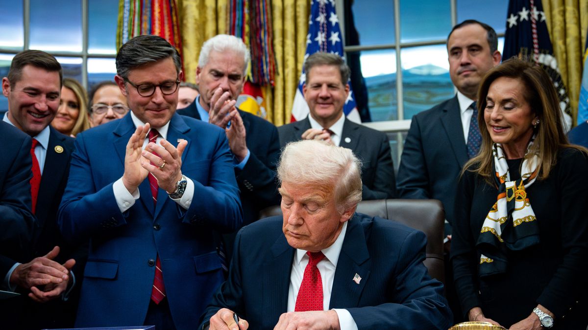 US President Donald Trump signs funding legislation to reopen the US government, in the Oval Office of the White House in Washington, DC, US, on Wednesday, Nov. 12, 2025. Trump signed legislation to end the longest government shutdown in US history, marking the official conclusion to a 43-day impasse that halted food aid to millions of households, canceled thousands of flights and forced federal workers to go unpaid for more than a month. Photographer: Bonnie Cash/UPI/Bloomberg via Getty Images