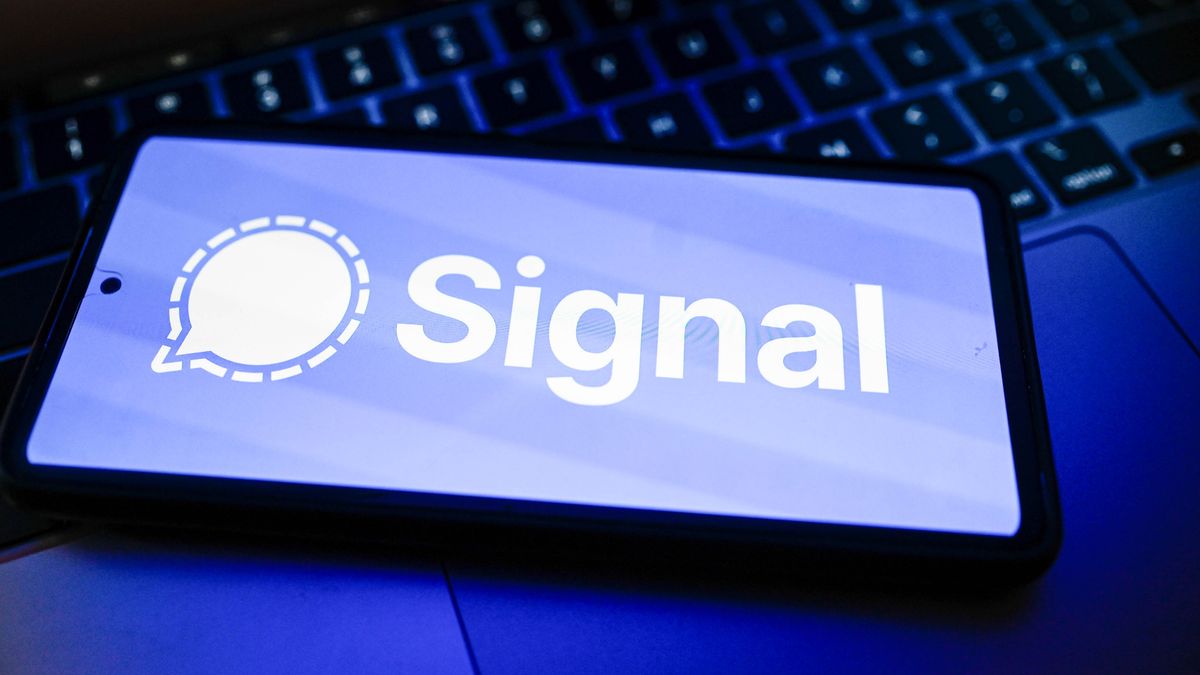 POLAND - 2026/04/23: In this photo illustration, the Signal logo is displayed on a smartphone on the top of a laptop. (Photo Illustration by Omar Marques/SOPA Images/LightRocket via Getty Images)