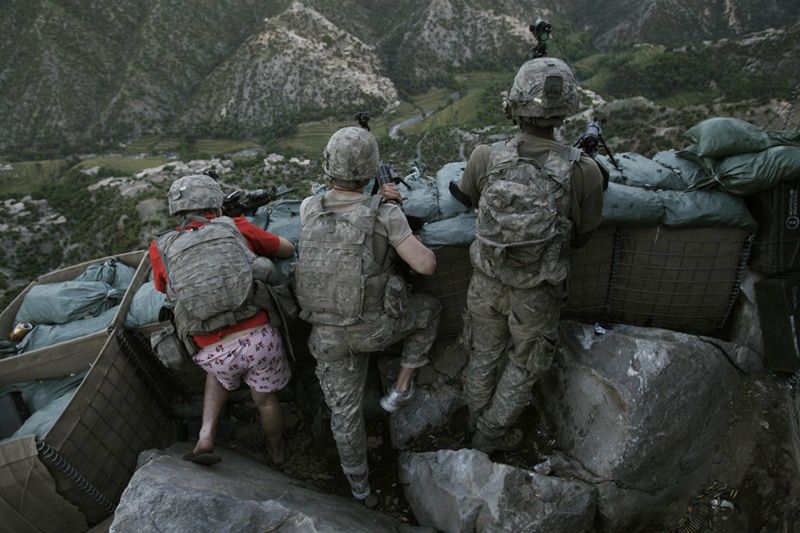 David Guttenfelder, USA, The Associated Press US soldiers respond to Taliban fire outside their bunker, Korengal Valley, Afghanistan, 11 May
