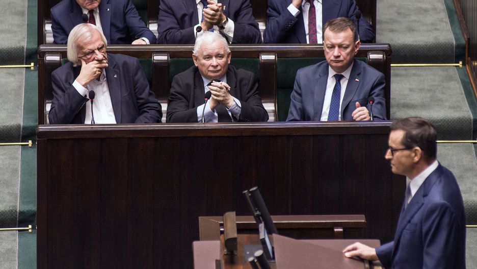 WARSAW, MASOVIAN VOIVODESHIP, POLAND - 2023/11/28: Jaroslaw Kaczynski (in the middle), leader of the Law and Justice (PiS) party listening to the speech of PM Mateusz Morawiecki. Continuation of the first session of the Lower House of Polish Parliament (Sejm) of the 10th term. (Photo by Attila Husejnow/SOPA Images/LightRocket via Getty Images)
