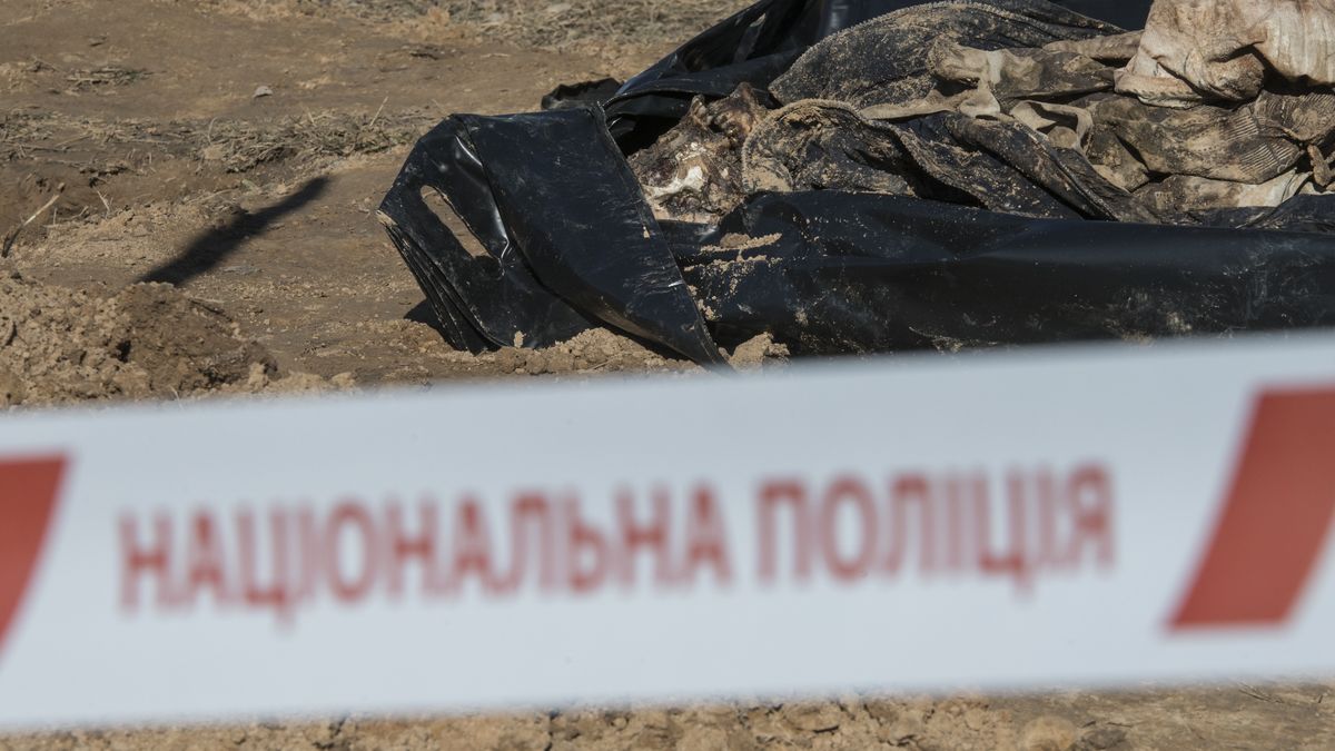 BORODIANKA, UKRAINE - MARCH 2: (EDITORS NOTE: Image contains graphic content.) Human body buried earlier in the cemetery have been exhumed for further examination on March 2, 2023 in Borodianka, Ukraine. The bodies of three more people who died as a result of Russian military aggression were discovered in Borodianka. The law enforcement officers exhumed these bodies and they will be taken to the forensic medical expert, where relevant examinations will be conducted. (Photo by Vladyslav Musiienko/Suspilne Ukraine/JSC "UA:PBC"/Global Images Ukraine via Getty Images)