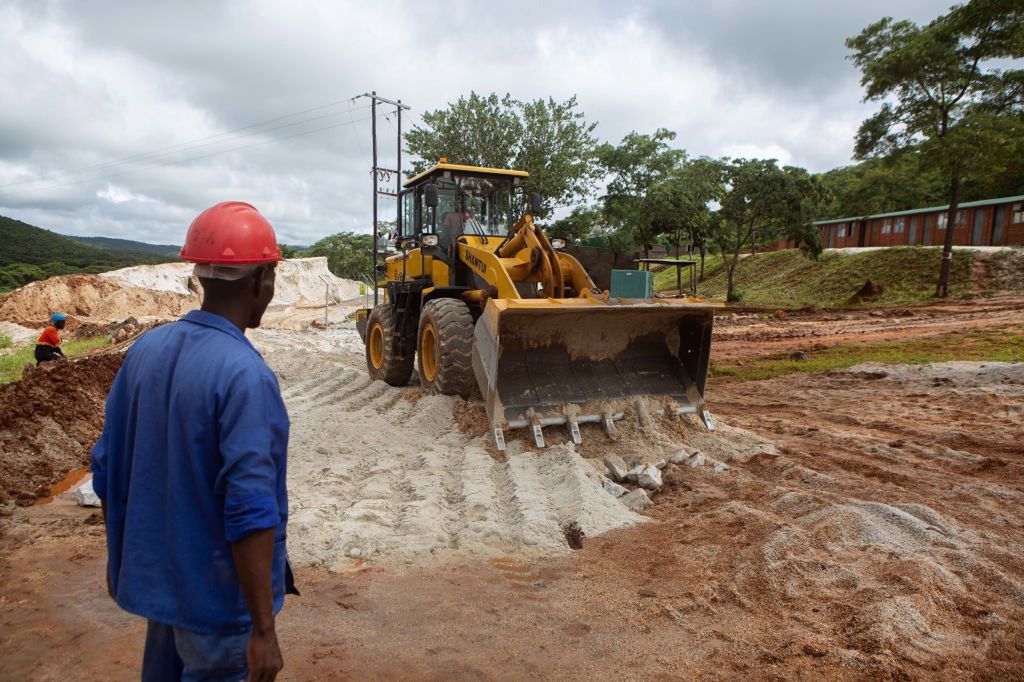 Hot weather around lithium deposits in Congo.  In the background there is a struggle between the great powers