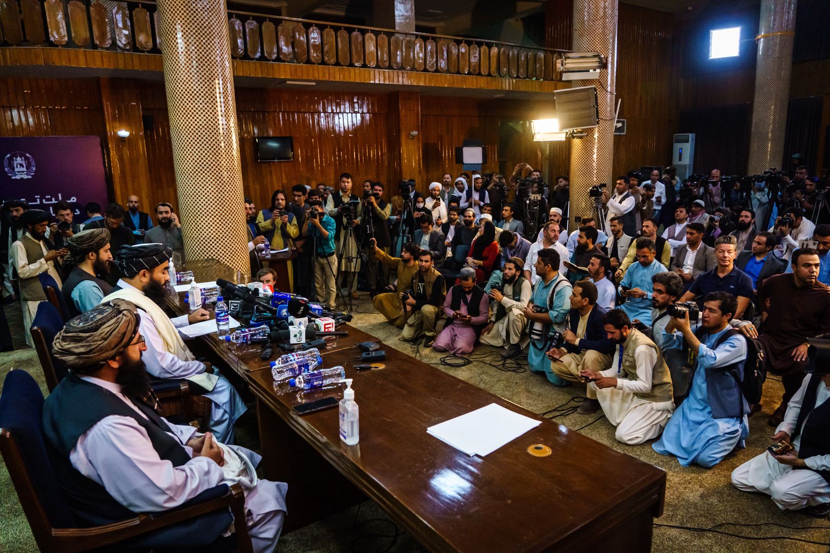 KABUL, AFGHANISTAN -- AUGUST 17, 2021: Zabihullah Mujahid, the Taliban spokesman for nearly 2 decades who worked in the shadows, makes his first-ever public appearance to address concerns about the Taliban' reputation with women's education, appearance and rights, television music and executions, during a press conference in Kabul, Afghanistan, Tuesday, Aug. 17, 2021. (MARCUS YAM / LOS ANGELES TIMES)