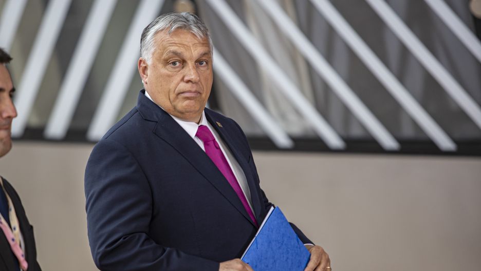 Viktor Orban Prime Minister of Hungary arrives at the special EU summit, walking next to the European flags behind the flag of Europe and talks to the media about the Russian sanctions. Special Meeting of the EU leaders, the European Council in Brussels, Belgium on May 30, 2022 (Photo by Nicolas Economou/NurPhoto via Getty Images)