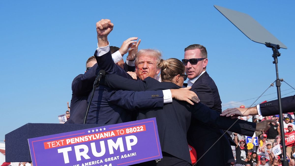 BUTLER, PENNSYLVANIA - July 13: Former president Donald Trump raises his arm with blood on his face during a campaign rally for former President Donald Trump at Butler Farm Show Inc. on Saturday, July 13, 2024 in Butler, Pa. Trump ducked and was taken offstage after loud noises were heard after he began speaking. 
(Photo by Jabin Botsford/The Washington Post via Getty Images)