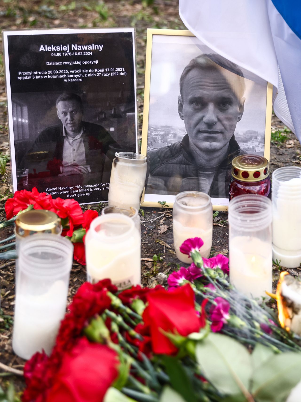 Flowers and candles in tribute to Alexiei Navalny in front of the Russian Consulate General in Krakow, Poland on February 18, 2024. Navalny, 47, Russian opposition politician, died two days before in the Russian prison about 40 miles north of the Arctic Circle, where he had been sentenced to 19 years. (Photo by Beata Zawrzel/NurPhoto via Getty Images)