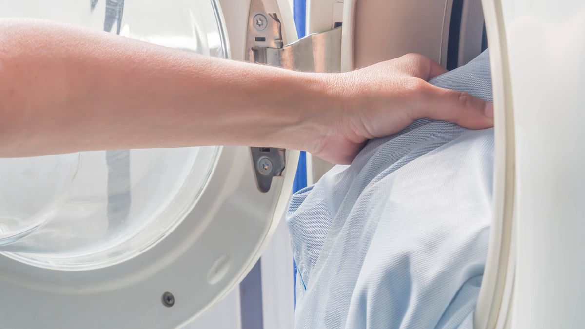 Closeup of woman 's hand. Putting dirty clothes in laundry bags into washing machine.KATECHATPORN DIDKAEWput into, close up, clothes, dirty, bags, hygiene, machine, laundry, woman, housework, female, loading, white, home, wash, washer, person, clothing, clean, dry, house, work, housewife, holding, household, electrical, door, appliance, color, hand, lifestyle