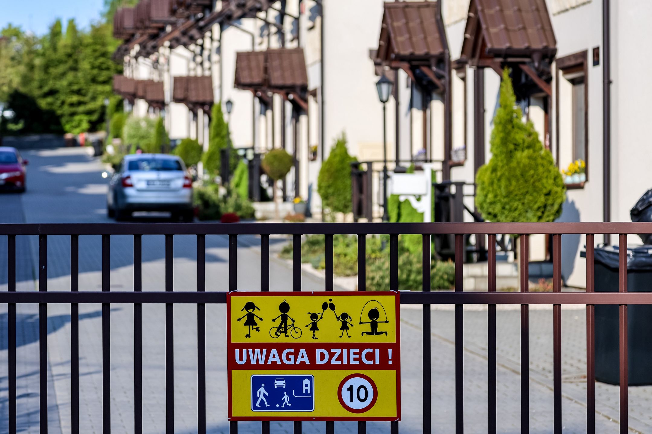 KRAKOW, MALOPOLSKIE, POLAND - 2024/04/25: The gate of a newly constructed residential estate in the northern district of Krakow, the second largest city in Poland. Despite hopes for market stabilization, the real estate market continues to experience new price increases. Prices have been steadily rising for several years, posing challenges for many young families striving to own property. (Photo by Dominika Zarzycka/SOPA Images/LightRocket via Getty Images)
