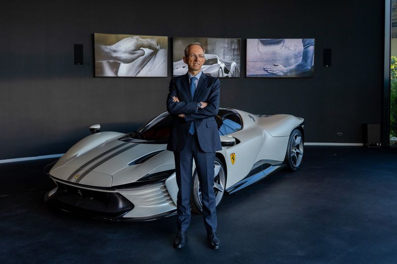 Benedetto Vigna, chief executive officer of Ferrari NV, in front of a Ferrari Daytona SP3 sports car at the company's headquarters in Maranello, Italy, on Tuesday, Feb. 7, 2023. Speaking at Ferraris Maranello headquarters, Vigna, 53, credited Tesla with accelerating change within an industry steeped in engine cylinders. Photographer: Francesca Volpi/Bloomberg via Getty Images
