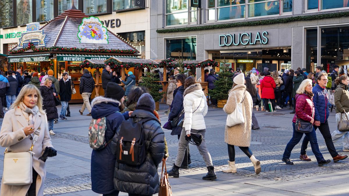 A bustling shopping street in Munich, Bavaria, Germany, on November 30, 2024, is alive with the festive spirit as shoppers fill the streets, admire holiday decorations, and select Christmas gifts. The atmosphere is lively, with a sense of excitement for the upcoming holidays. Kaufinger Strasse in Munich is crowded as many people are out shopping for Christmas gifts. The store windows are decorated with festive displays, showcasing a wide range of gifts and holiday items. Passersby stop to admire the windows and choose presents for the upcoming holiday season. Numerous Christmas stalls in the middle of the street invite people to drink mulled wine or eat snacks. As one of Munich's central shopping streets, Kaufinger Strasse attracts both locals and tourists who are completing their pre-Christmas shopping. The festive atmosphere is enhanced by the Christmas decorations and the increasing number of shoppers in the stores. The street becomes a lively spot for those looking to buy gifts and experience the holiday spirit. (Photo by Michael Nguyen/NurPhoto via Getty Images)