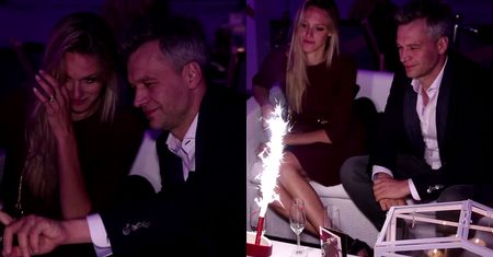 Żebrowski pije szampana z żoną