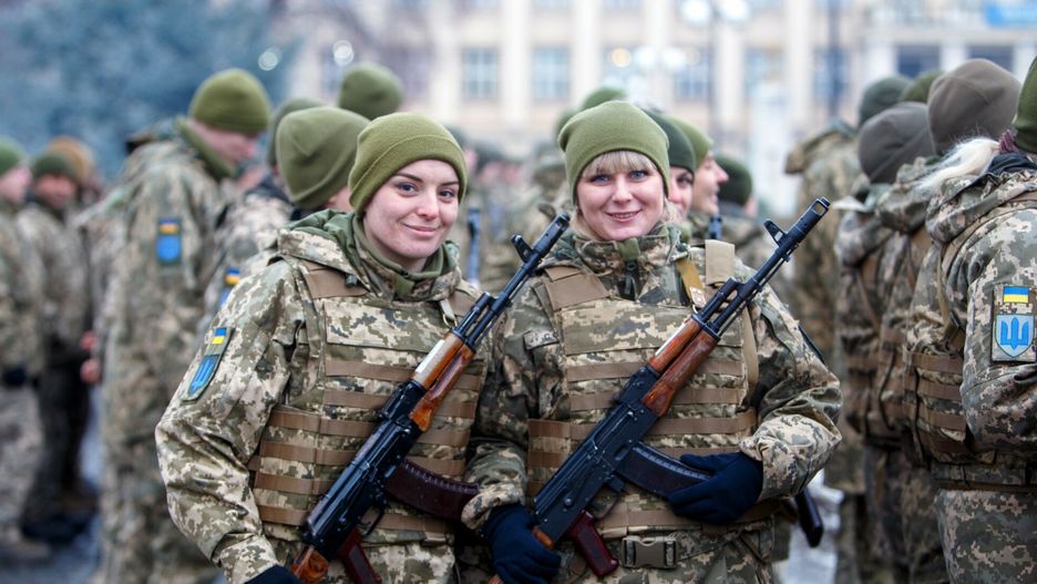 arch48UZHHOROD, UKRAINE - DECEMBER 28, 2021 - Soldiers pose with rifles during a welcome ceremony upon the return of the 128th Separate Mountain Assault Zakarpattia Brigade from the area of the Joined Forces Operation (JFO) in the east of the country, Uzhhorod, western Ukraine.Serhii Hudak