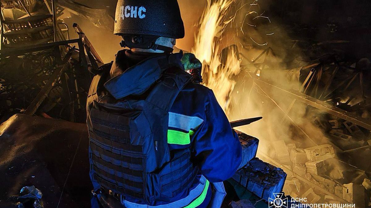 KAMIANSKE, UKRAINE - APRIL 16: (----EDITORIAL USE ONLY - MANDATORY CREDIT - 'UKRAINIAN STATE EMERGENCY SERVICE / HANDOUT' - NO MARKETING NO ADVERTISING CAMPAIGNS - DISTRIBUTED AS A SERVICE TO CLIENTS----) Firefighters try to extinguish the fire after the Russian attack which caused several fires and destruction on the territory of a private enterprise in Kamianske, Dnipro Oblast, Ukraine on April 16, 2025. Two men were injured, 10 cars and a gas pipeline were damaged during the attack. (Photo by State Emergency Service of Ukraine/Anadolu via Getty Images)