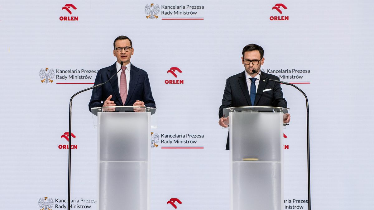 WARSAW, POLAND - 2023/04/17: Prime Minister Mateusz Morawiecki (L) and Daniel Obajtek (R), the President and CEO of the Polish Oil Company ORLEN speak at the press conference in Warsaw. Daniel Obajtek, the President and CEO of the Polish Oil Company ORLEN, announced the details of the planned investments in Small Modular Reactors (SMR) for Poland. For this purpose, the company Orlen Synthos Green Energy (OSGE) was established, supported by the Polish billionaire - Michal Solowow. OSGE will buy reactors from US-based GE Hitachi. (Photo by Attila Husejnow/SOPA Images/LightRocket via Getty Images)