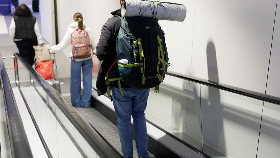 MADRID, SPAIN - APRIL 05: A man with a backpack and a mat on an escalator at Mendez Alvaro South Station, April 5, 2023, in Madrid, Spain.  Today starts the second phase of the Special Operation that the Directorate General of Traffic puts in place, until midnight next Monday, April 10, on the occasion of Easter. This is the most important phase of this Special Operation in terms of volume since 9,400,000 trips are expected, which means an average of 1,566,667 daily trips, 2.47% more than the actual data of 2022. (Photo By Eduardo Parra/Europa Press via Getty Images)