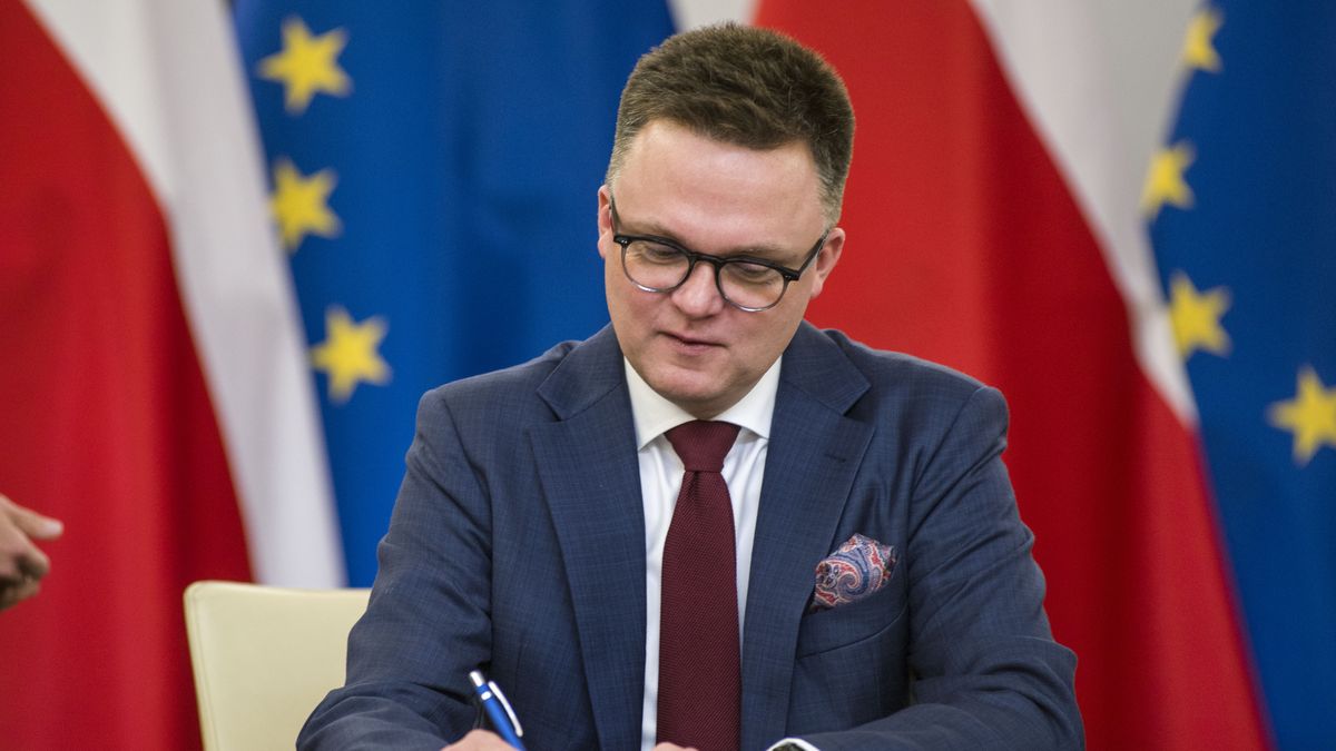 WARSAW, POLAND - 2023/11/10: Szymon Holownia, head of the Poland 2050 party, signs the coalition agreement in the Parliament. The leaders of Polish opposition parties have signed a coalition agreement that lays out a road map for governing the nation over the next four years. The parties collectively won a majority of votes in last month's parliamentary election. Their candidate to be the next prime minister is Donald Tusk, a former prime minister who leads the largest of the opposition parties, the centrist Civic Platform. Tusk said the parties worked to seal their agreement a day before the Independence Day holiday, adding that, "We wanted to show that we are ready to take responsibility for our homeland." He said the agreement would offer a set of "signposts and recommendations" for the government he plans to lead. (Photo by Attila Husejnow/SOPA Images/LightRocket via Getty Images)