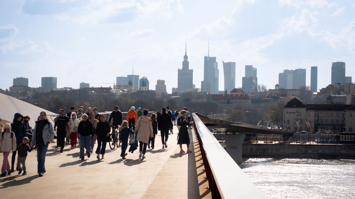 Crowds walk and cycle on the pedestrian and bicycle bridge over the Vistula River in Warsaw, Poland, on March 29, 2026. (Photo by Mateusz Wlodarczyk/NurPhoto via Getty Images)