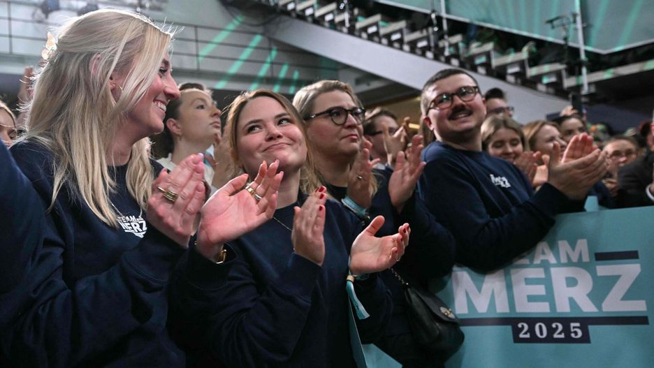 Temporary
Supporters of the Christian Democratic Union (CDU) react after the first exit polls in the German general elections were announced on TV during the electoral evening in Berlin on February 23, 2025. (Photo by INA FASSBENDER / AFP)
INA FASSBENDER