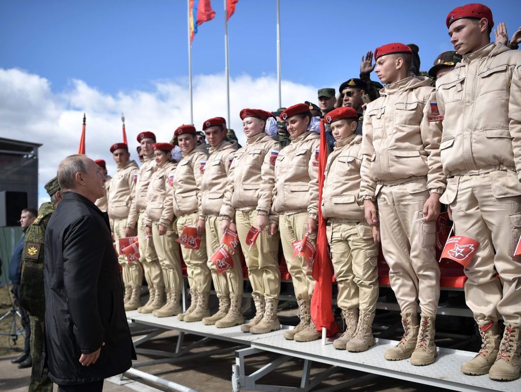 Russia's President Putin at Vostok 2018 military exercises in Transbaikal TerritoryTRANSBAIKAL TERRITORY, RUSSIA - SEPTEMBER 13, 2018: Russia's President Vladimir Putin (L) greets Yunarmiya [Young Army] members during a parade of army hardware and aviation involved in the main stage of the Vostok 2018 military exercises held jointly by the Russian Armed Forces and the Chinese People's Liberation Army at the Tsugol range. Alexei Nikolsky/Russian Presidential Press and Information Office/TASS (Photo by Alexei Nikolsky\TASS via Getty Images)Alexei NikolskyRussian Army, China, defense, military, wargame, drills, manoeuvres, firing range, international relations, cooperation, FeedRouted_Global