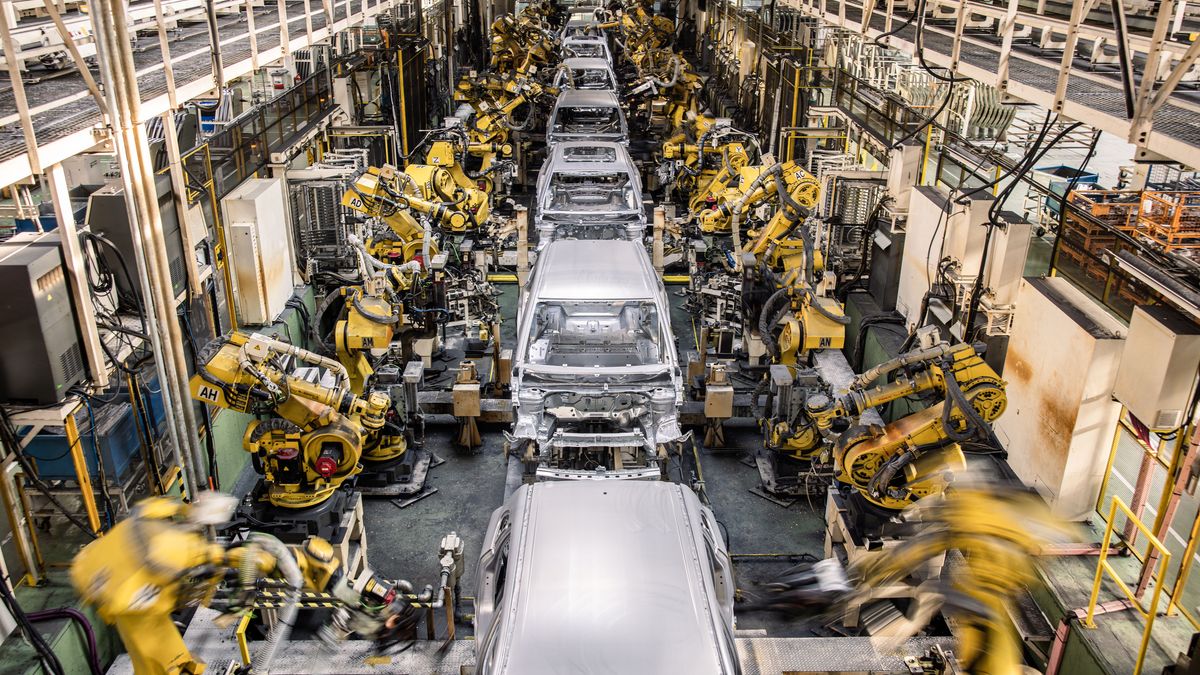 Robotic arms weld the body shells of automobiles inside the Suzuki Motor Corp. plant in Esztergom, Hungary, on Wednesday, Oct. 19, 2022. European automotive stocks gained a boost from figures showing that new car sales in the region rose for a second month in September as supply-chain issues eased. Photographer: Akos Stiller/Bloomberg via Getty Images