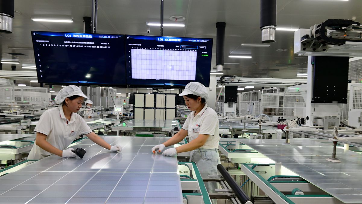 JINHUA, CHINA - AUGUST 30: Employees work on the production line of solar modules inside a photovoltaic plant on August 30, 2024 in Jinhua, Zhejiang Province of China. In the first seven months of this year, solar power's cumulative power generation capacity increased by 49.8 percent to 740 million kilowatts in the country, data showed. (Photo by Shi Bufa/VCG via Getty Images)