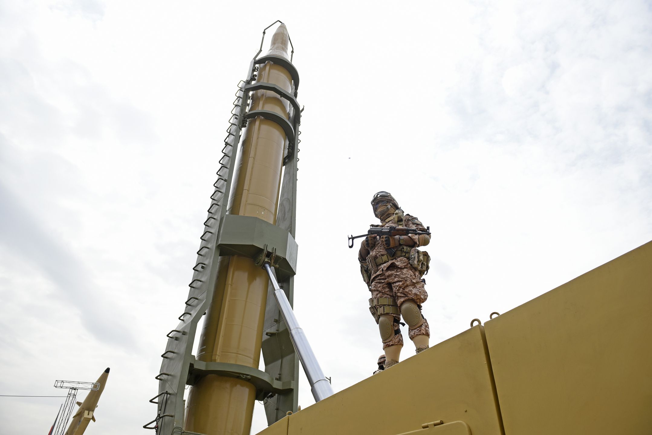 April 29, 2022, Tehran, Tehran, Iran: A member of the Revolutionary Guard stands in front of Shahab-3 missile which is displayed during the annual pro-Palestinian Al-Quds, or Jerusalem, Day rally in Tehran, Iran, Friday, April 29, 2022.