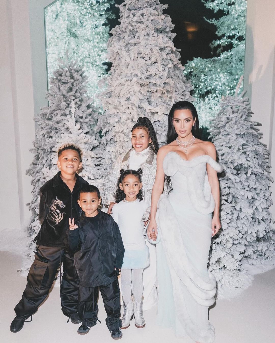 Kim Kardashian with children at the Christmas party