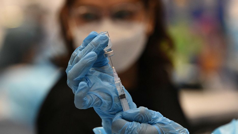 arch48A medical worker prepares a BioNtech-Pfizer Covid-19 coronavirus vaccine at a colisium in Makati City, suburban Manila on November 29, 2021, as the Southeast Asian nation launched a three-day vaccination drive targeting nine million people as young as 12 in an effort to accelerate the roll-out of jabs, amidst the threat of heavily mutated coronavirus variant Omicron. (Photo by Ted ALJIBE / AFP)TED ALJIBE