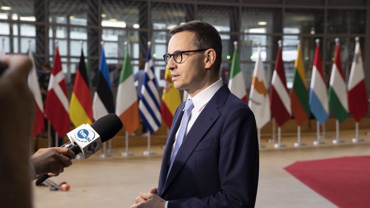 Mateusz Morawiecki Prime Minister of Poland arrives at the EU summit, walking next to the European flags, flag of Europe and talks to the media while is answering questions from journalists. During this meeting Ukraine and Moldova have both been accepted as EU candidate members status. Meeting of the EU leaders, the European Council and Eurosummit in Brussels, Belgium on June 24, 2022 (Photo by Nicolas Economou/NurPhoto via Getty Images)
