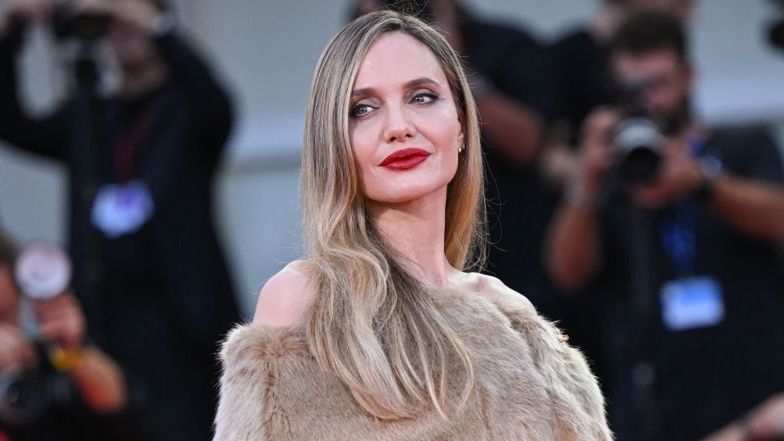 Angelina Jolie shines at Venice Film Festival, barely avoids Brad Pitt