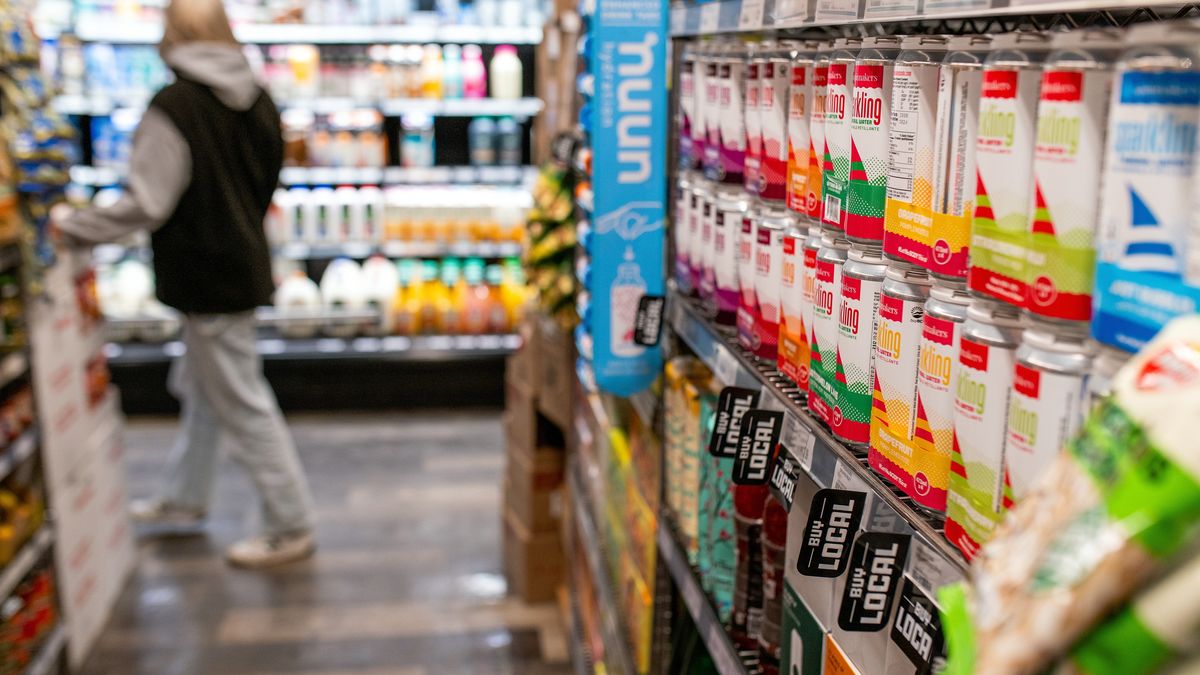 "Buy Local" signs on grocery store shelves in Victoria, British Columbia, Canada, on Monday, Feb. 10, 2025. Canada will keep trying to persuade the Trump administration to drop its tariff plans, in part by reaching out to US states that have significant trading relationships with their northern neighbor, trade minister Mary Ng said. Photographer: James MacDonald/Bloomberg via Getty Images