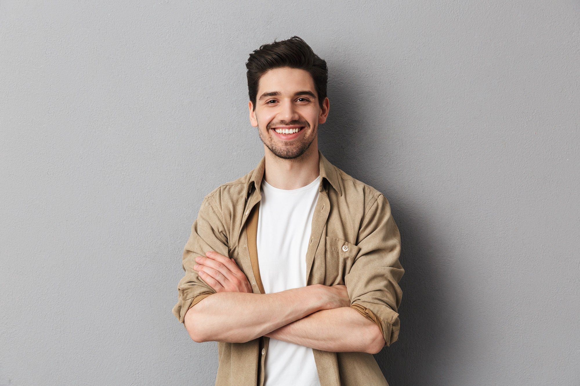 Portrait of a happy young casual man standingPortrait of a happy young casual man standing with arms folded isolated over gray backgroundmale, man, people, young, happy, casual, joyful, crossed, adult, isolated, guy, standing, smile, attractive, background, handsome, stubble, worker, style, looking, confident, arm, hand, business, shirt, fashion, caucasian, cheerful, person, clothing, content, hair, confidence, lifestyle, leader, career, education, freshness, expertise, professional, trendy, positivity, shopping, work, arms, folded, male, man, people, young, happy, casual, joyful, crossed, adult, isolated, guy, standing, smile, attractive, background, handsome, stubble, worker, style, looking, confident, arm, hand, business, shirt, fashion, caucasian, cheerful, person, clothing, content, hair, confidence, lifestyle, leader, career, education, freshness, expertise, professional, trendy, positivity, shopping, work, arms, folded