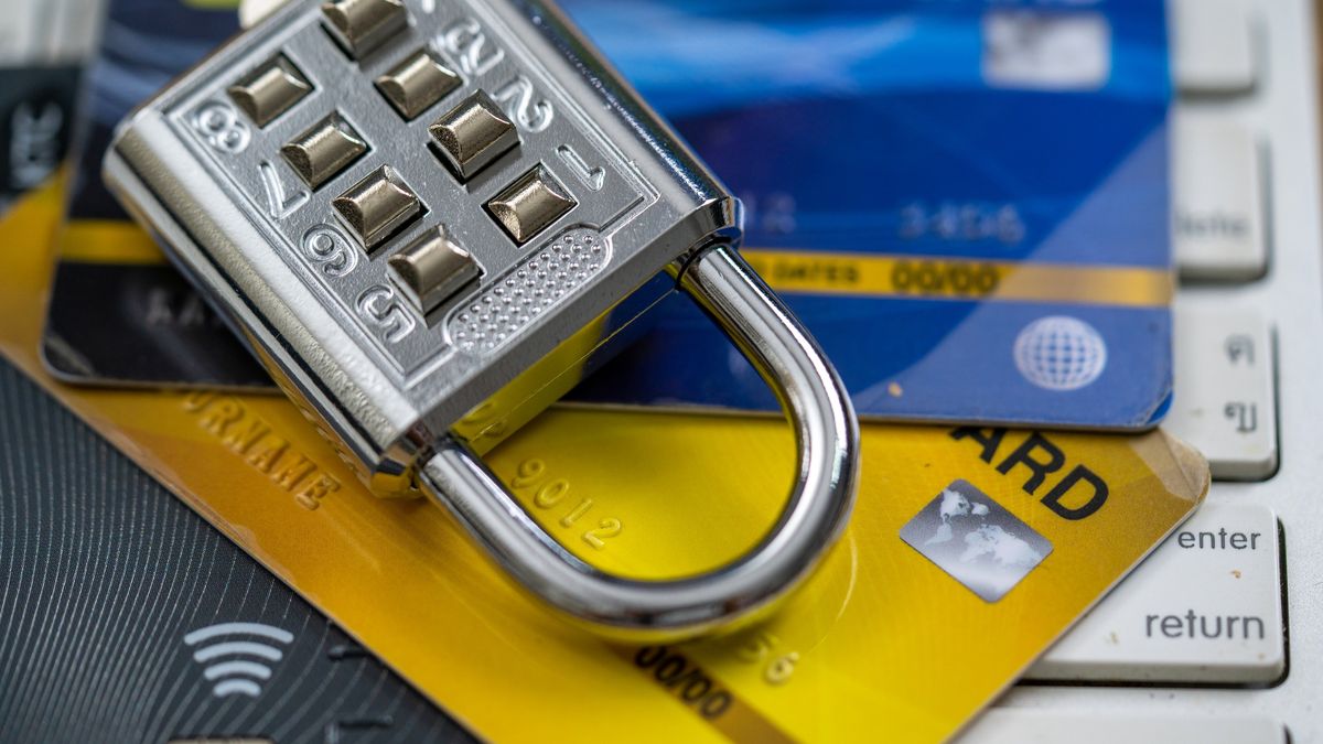 Credit cards and lock on computer keyboard.
Credit cards and lock on computer keyboard.
boonchai wedmakawand
