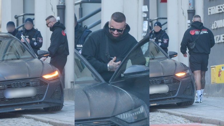 Uśmiechnięty Daniel Majewski wsiada do samochodu za ponad 600 tysięcy