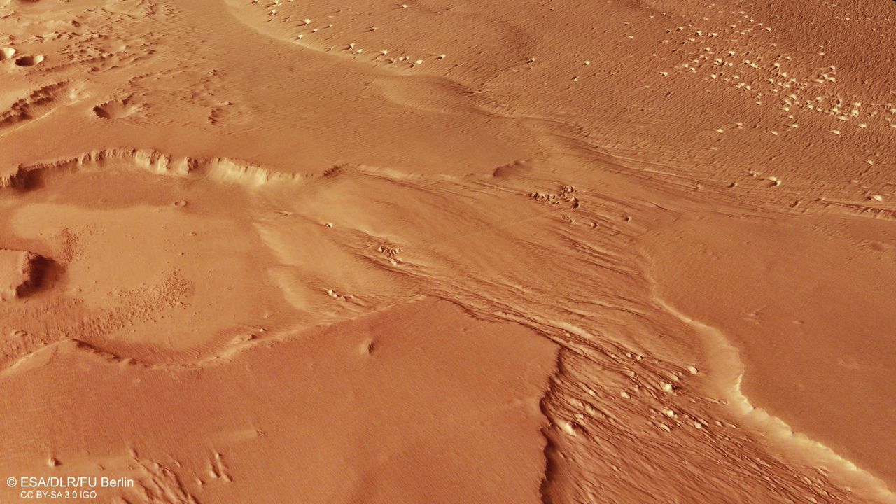 A photo of the Medusae Fossae formation, under which there are said to be vast deposits of water ice.