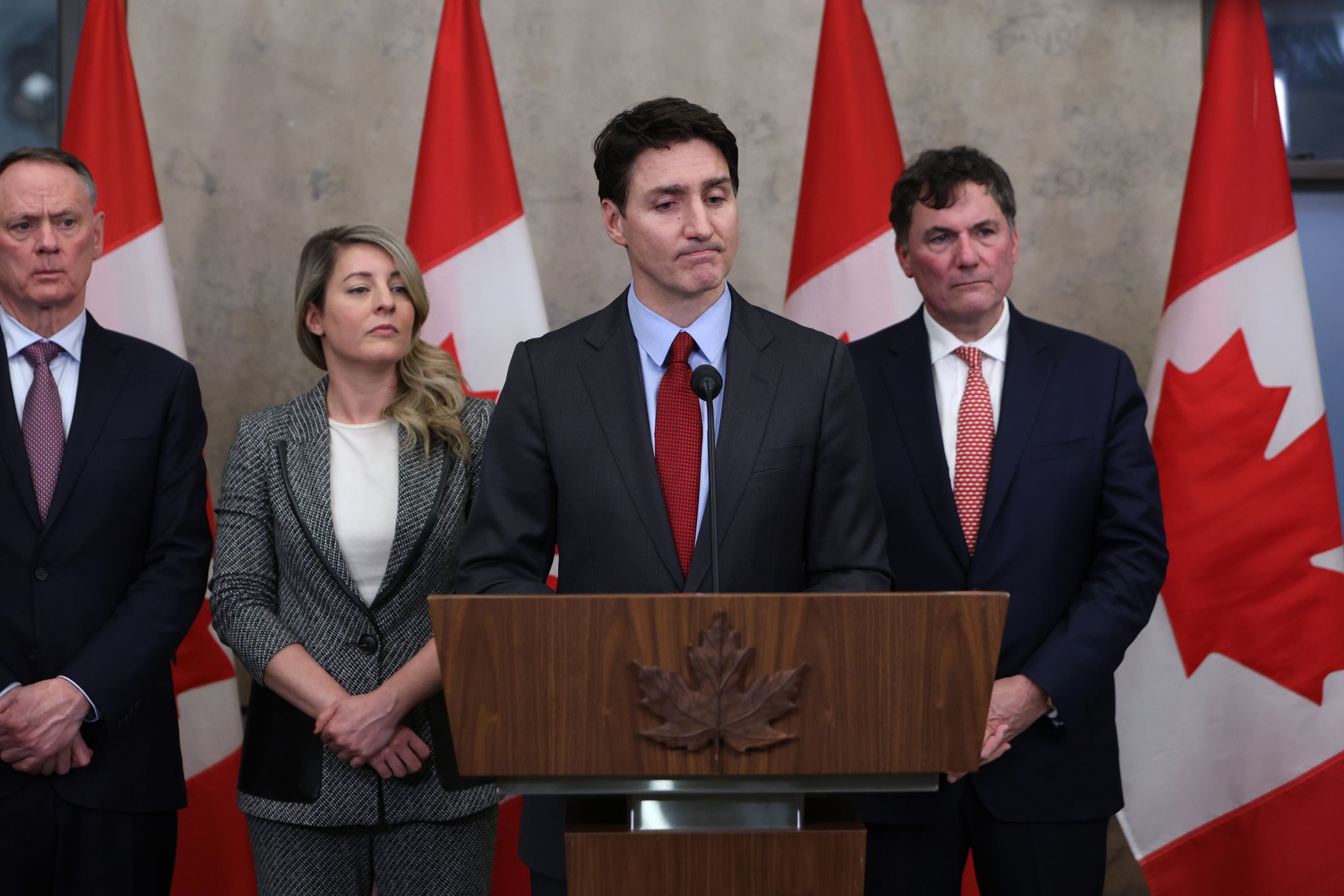 Justin Trudeau, Canada's prime minister, center, speaks during a press conference with, David McGuinty, Canada's minister of public safety, from left, Melanie Joly, Canada's foreign minister, and Dominic LeBlanc, Canada's finance and intergovernmental affairs minister, on Parliament Hill in Ottawa, Ontario, Canada, on Saturday, Feb. 1, 2025. Canada is set to introduce escalating retaliatory counter-tariffs to try to turn Americans against President Donald Trump's 25% levies on Canadian goods, a threat that's causing the country to rethink its dependence on its southern neighbor. Photographer: David Kawai/Bloomberg via Getty Images