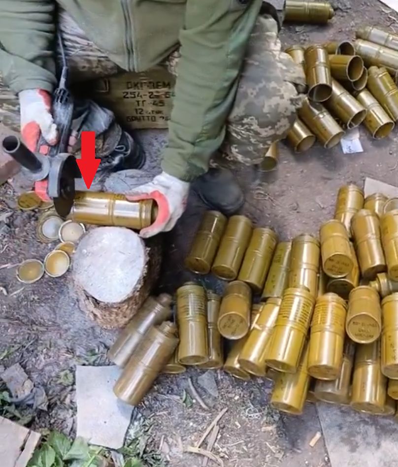A Ukrainian modifying RKG-3 grenades for use on drones.