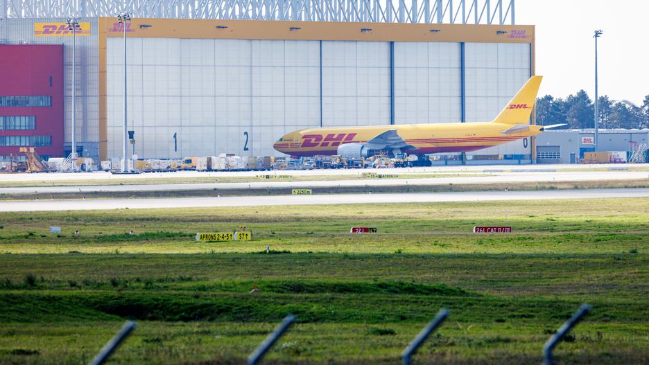 SCHKEUDITZ, GERMANY - OCTOBER 15: A cargo airplane of the DHL package delivery company stands on the tarmac at Leipzig/Halle Airport on October 15, 2024 in Schkeuditz, Germany. Investigators suspect Russian sabotage behind the fire originating from a package at the DHL airport center last July. According to authorities, the late arrival of the package on a plane from a Baltic country resulted in the package igniting on the ground. Had it arrived on time, the package would have ignited on the outgoing flight and caused the airplane to crash. (Photo by Jens Schlueter/Getty Images)