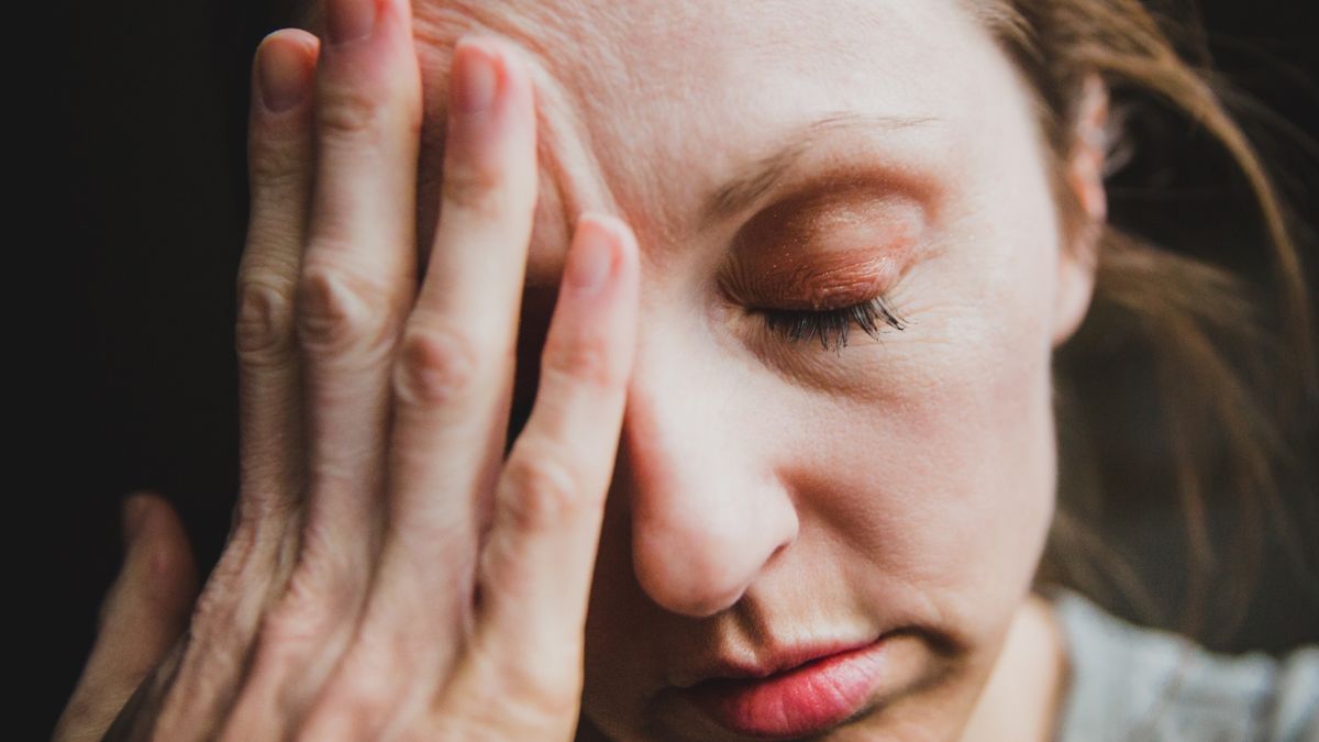 Woman with Headache Overwhelmed by Stress, Anxiety, or Depression
Woman with headache, overwhelmed with stress and anxiety. Mental health conceptual image for depression, injury, or migraine illness. Sad woman looking down and holding hand over eye and forehead. Fatigued woman looks tired and stressed, distraught and exhausted.
Jena Ardell