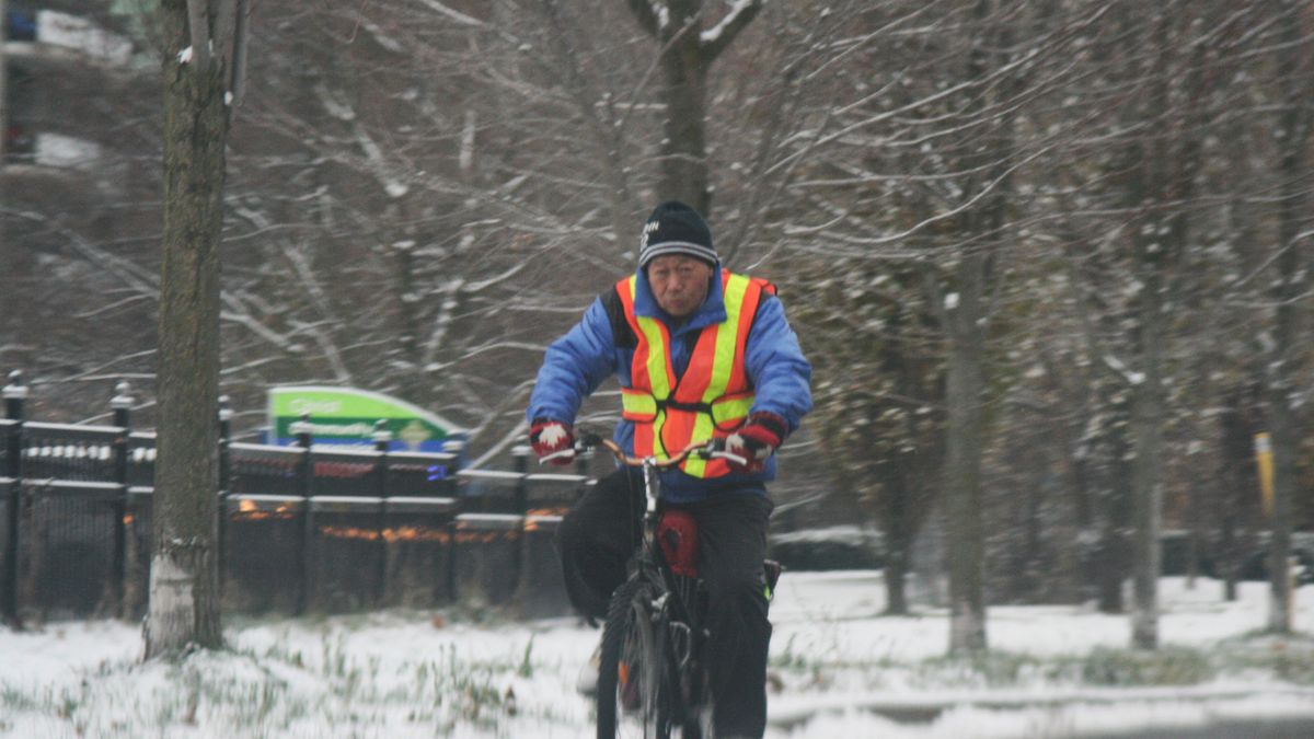 A man rides a bike along Yonge Street during a cold winter day in Toronto, Ontario, Canada, on December 2, 2025. (Photo by Creative Touch Imaging Ltd./NurPhoto via Getty Images)