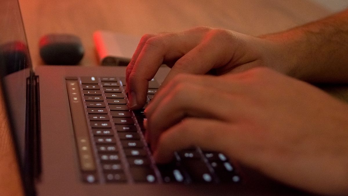 Man's hands are writting on a Macintosh (Apple) laptop in Athens, Greece on April 4, 2022. (Photo by Nikolas Kokovlis/NurPhoto via Getty Images)
