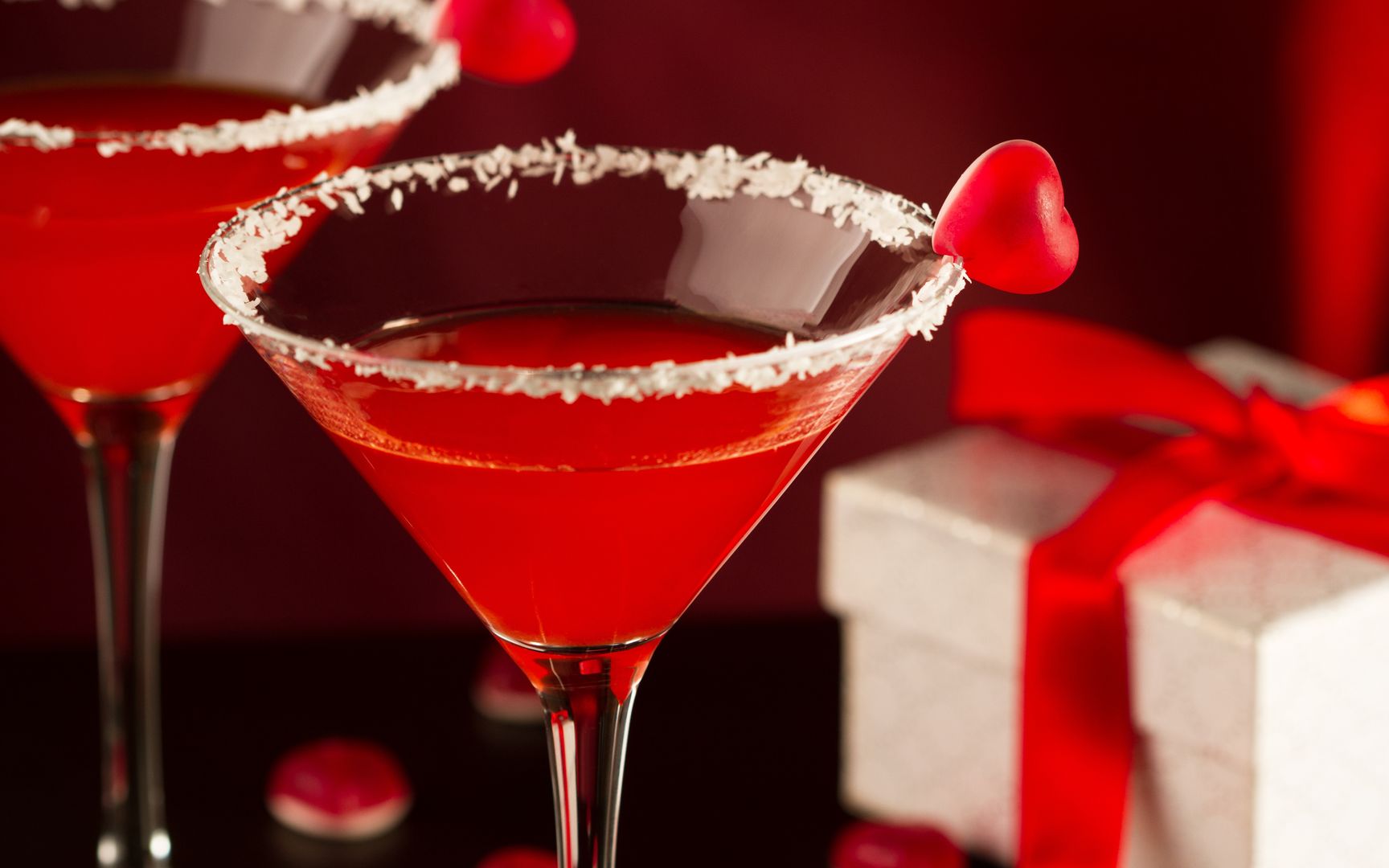 Red cocktails in martini glasses for Valentines dayRed cocktails in martini glasses for Valentines daycocktail, martini, red, drink, concept, ice, heart, nobody, cosmo, love, cosmopolitan, float, valentine, shaped, perspective, beverage, cube, vertical, shape, up, close, above, candy, table, gift, box, glasses