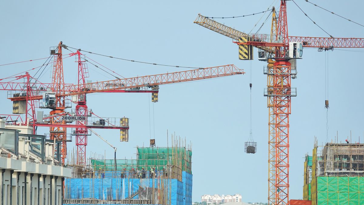 YANTAI, CHINA - JULY 23, 2024 - Tower cranes are seen at a real estate construction site in Yantai, Shandong province, China, July 23, 2024. On July 15, 2024, the National Statistics released the basic situation of the national real estate market from January to June. From January to June, the investment in real estate development nationwide was 5,252.9 billion yuan, down 10.1 percent year on year; Among them, residential investment was 3,988.3 billion yuan, down 10.4%. (Photo credit should read CFOTO/Future Publishing via Getty Images)
