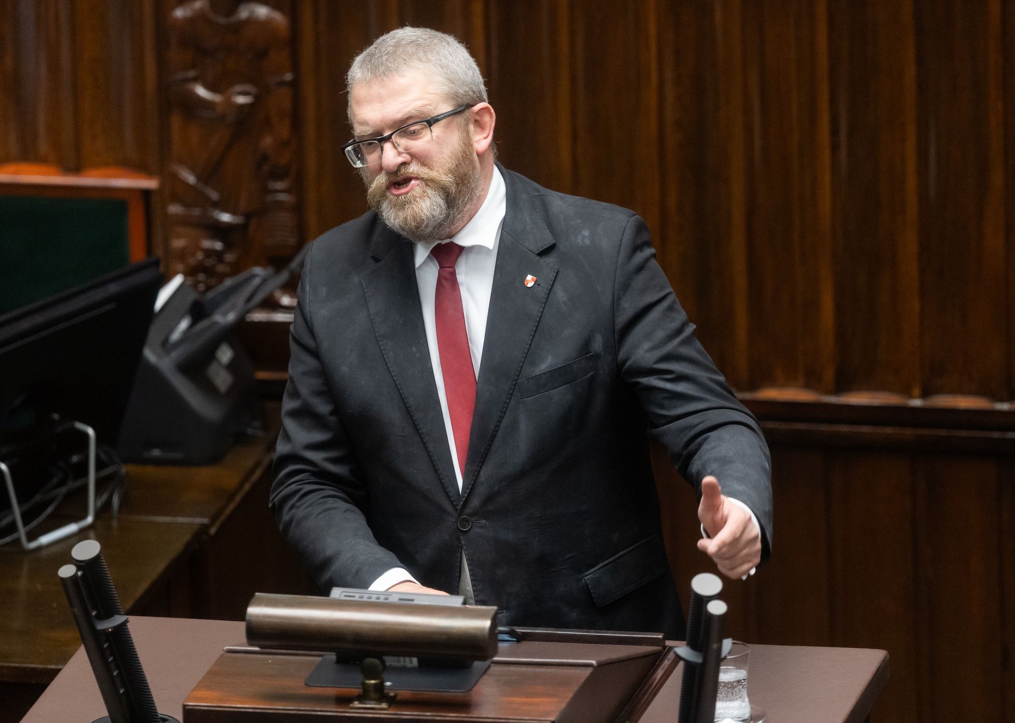 Grzegorz Braun is participating in the parliamentary debate on the appointment of Donald Tusk's government in Warsaw, Poland, on December 12, 2023. (Photo by Foto Olimpik/NurPhoto via Getty Images)